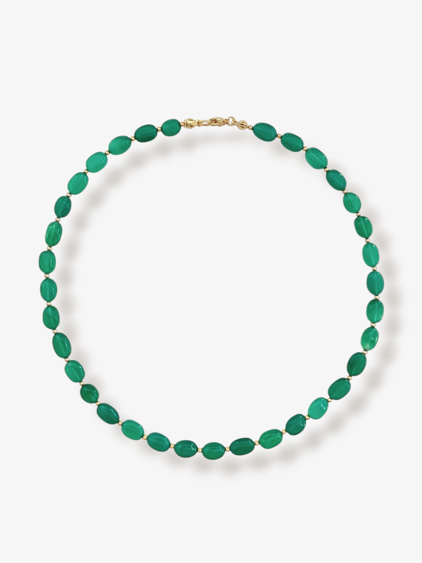 Green onyx gemstone necklace with green smooth oval beads and 14k gold filled or solid gold clasp with a minimalist design on a neutral background