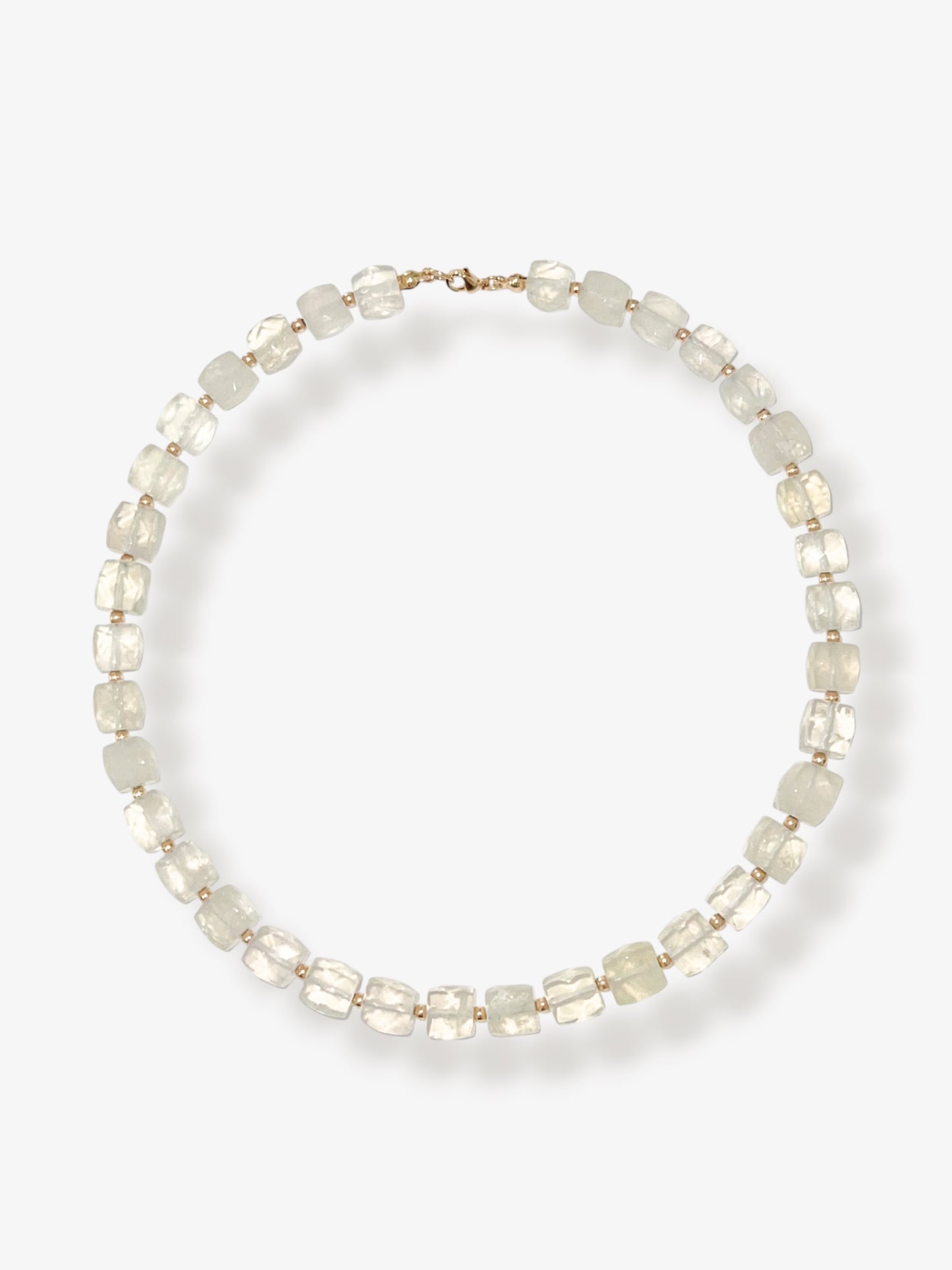 Lemon Quartz beaded gemstone necklace with light yellow faceted cube beads and 14k gold filled clasp and accent beads with a minimalist design on a neutral background
