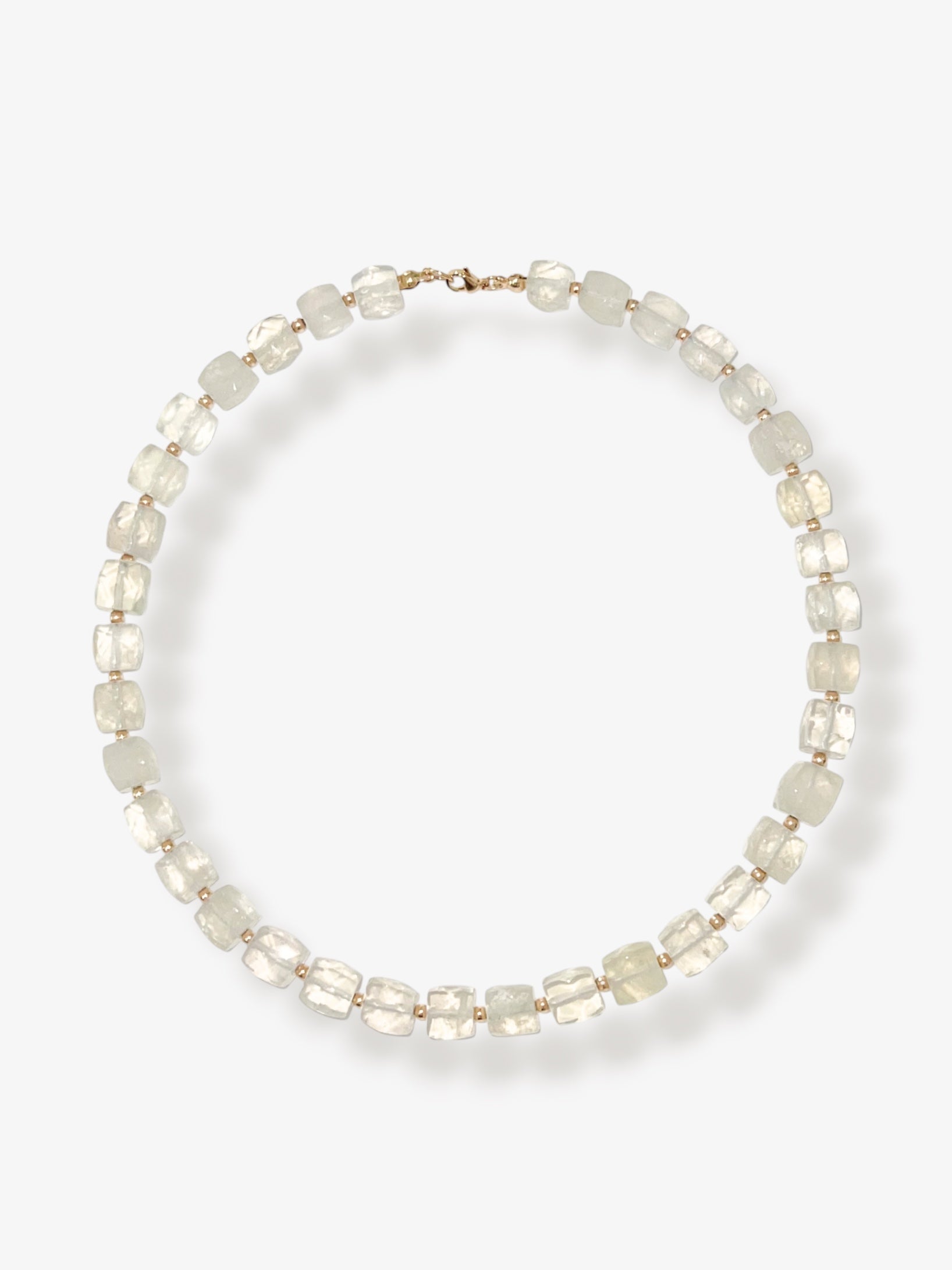 Lemon Quartz beaded gemstone necklace with light yellow faceted cube beads and 14k gold filled clasp and accent beads with a minimalist design on a neutral background