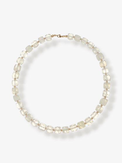 Lemon Quartz beaded gemstone necklace with light yellow faceted cube beads and 14k gold filled clasp and accent beads with a minimalist design on a neutral background