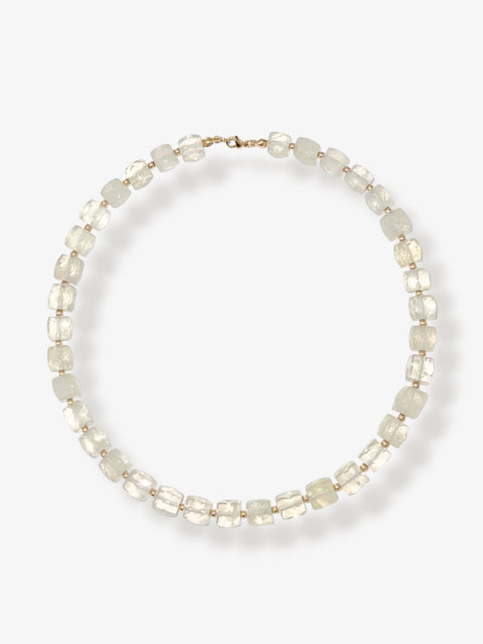 Lemon Quartz beaded gemstone necklace with light yellow faceted cube beads and 14k gold filled clasp and accent beads with a minimalist design on a neutral background