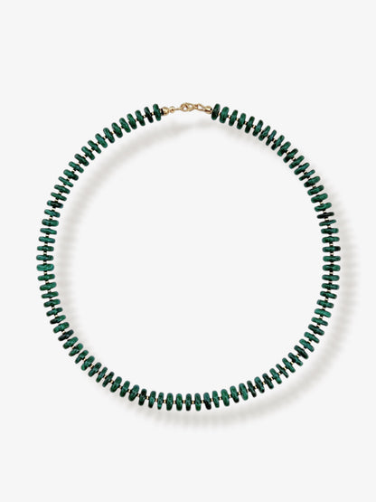 Malachite beaded gemstone necklace with chunky dark green smooth disc rondelle beads and 14k gold filled beads and clasp with minimalist design on a neutral background