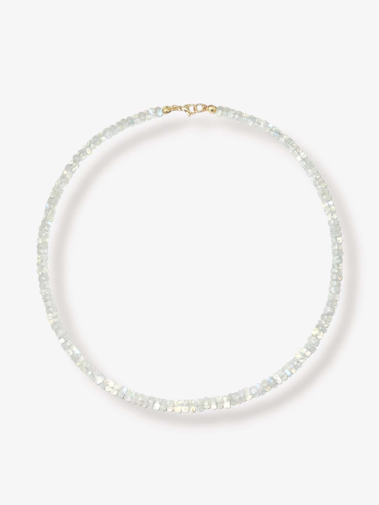 Rainbow moonstone beaded gemstone necklace with white faceted rondelle beads and 14k solid gold or gold filled clasp with minimalist design on a neutral background