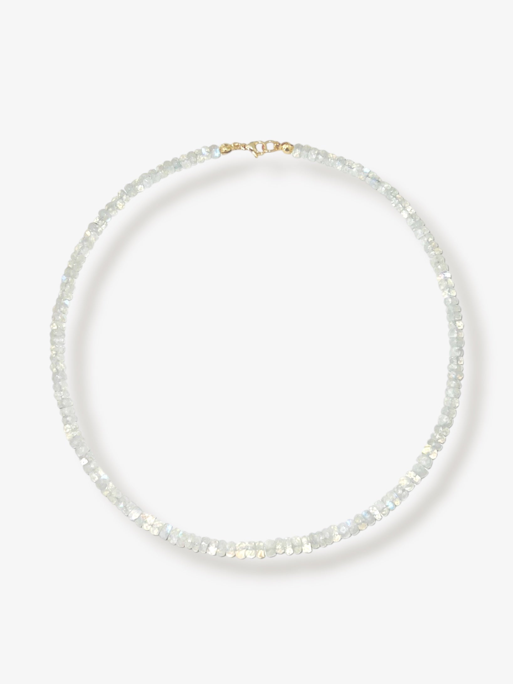 Rainbow moonstone beaded gemstone necklace with white faceted rondelle beads and 14k solid gold or gold filled clasp with minimalist design on a neutral background