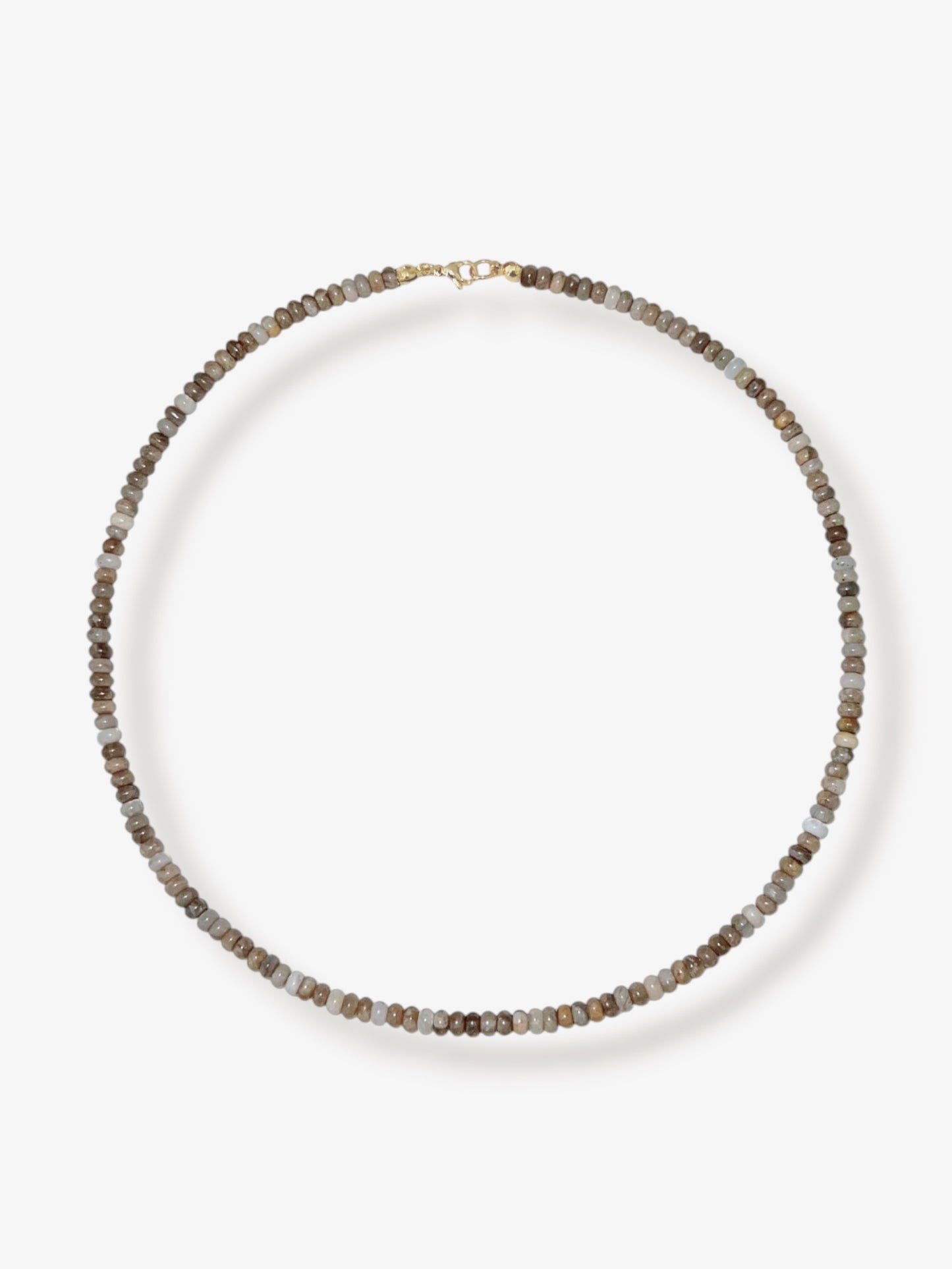 Dainty silver leaf jasper beaded gemstone necklace with rondelle beads featuring a multi-tone or neutral shades including beige, tan, brown, grey, and white with smooth polished finish completed with 14k gold filled or solid gold clasp with a minimalist design on a neutral background